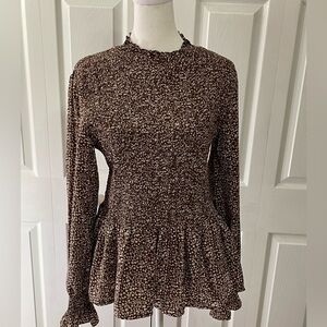 Flawless brand blouse with a stretchy smocking top and ruffled bottom hem